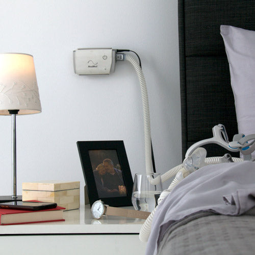 Mount being used to mount Air mini on wall next to bed