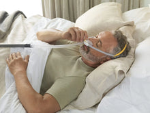 Load image into Gallery viewer, Man in bed wearing F&amp;P Solo Pillow Mask 