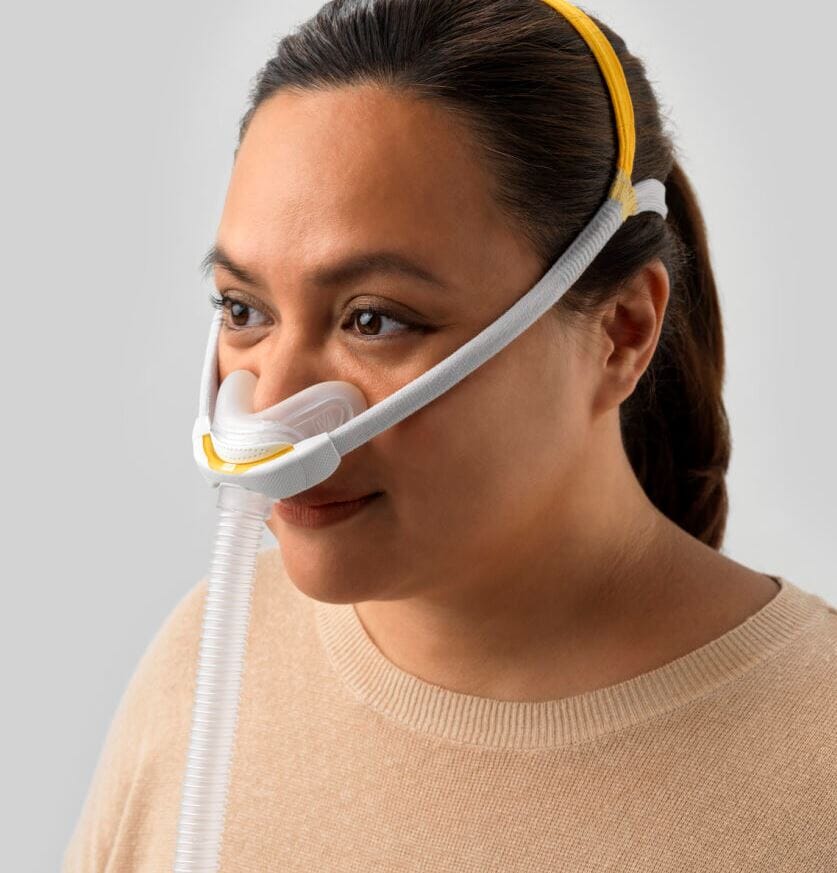 Woman wearing F&P Solo Nasal Mask