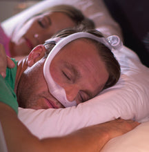Load image into Gallery viewer, man sleeping in bed wearing Philips Respironics DreamWear Under the Nose Mask