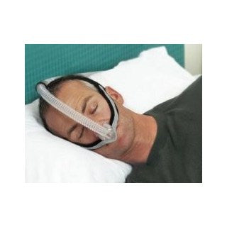 Man sleeping wearing Fisher and Paykel Opus Nasal Pillow Mask