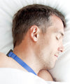 man sleeping wearing Night Shift Postional Therapy