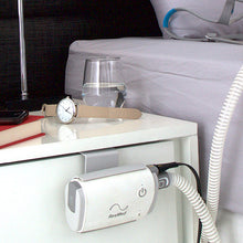 Load image into Gallery viewer, Caddy being used to secure Air mini on front of bedside table