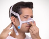 Man putting on the ResMed Airfit N20 Nasal Mask